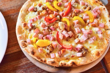 Top View of Italian-Style Hawaiian Pizza on Rustic Table