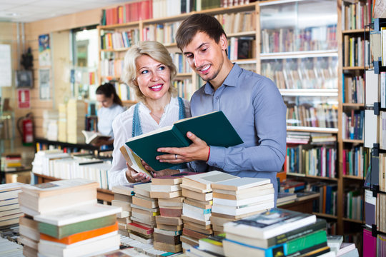 woman and man having books