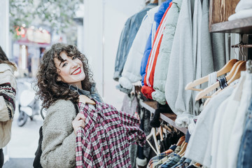 Woman buying clothes at the fashion store