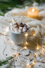 Winter hot drink, cacao with marshmallows and christmas decorations, spicy hot chocolate