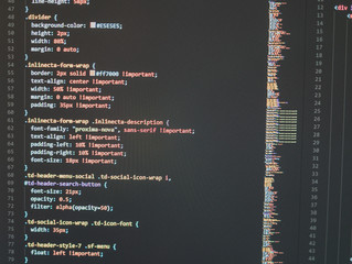 Web developer's computer screen with code