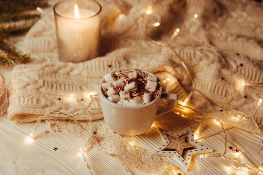 Hot chocolate with melted marshmallow Christmas Background Holiday Candy cane Warming Winter Drink Toned image Vintage style