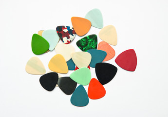 colorful guitar picks on white. guitar accessories