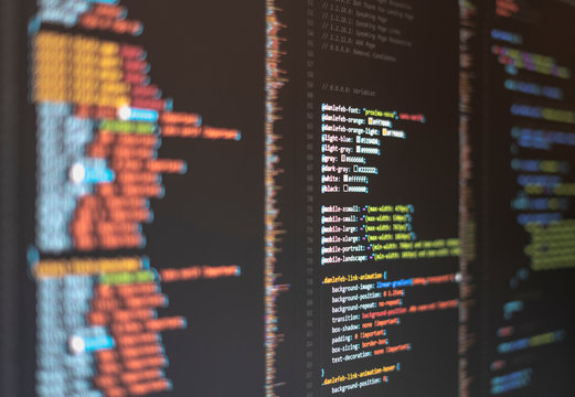 Web developer's computer screen with code