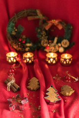 Fototapeta premium Christams decoration. Homemade Christmas tree shaped gingerbread cookies in the red mood. 
