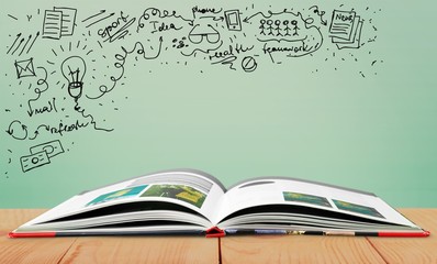 Open book on old wooden table