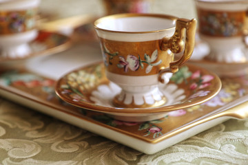 Romantic antique coffee service in Biedermaier style, hand painted in gold and enamel with colorful flowers