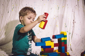 small child learns to fold constructor