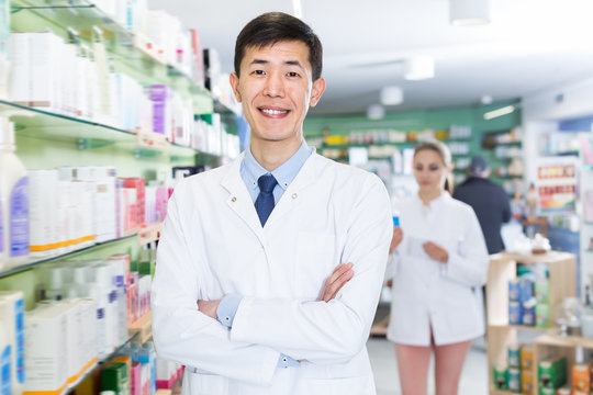 Positive korean man is standing with medicines