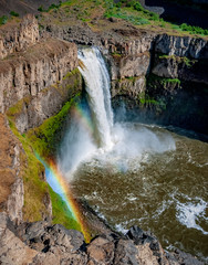 tall waterfall with rainbow