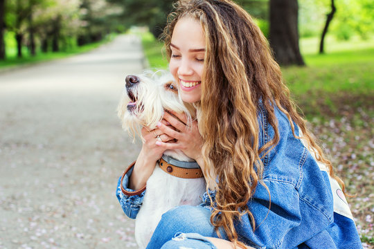 Portrait of a beautiful woman with dog.