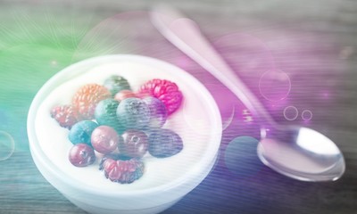 Yogurt with forest berries  on wooden table
