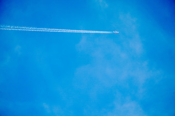 Clearly beautiful blue sky with white line plane.