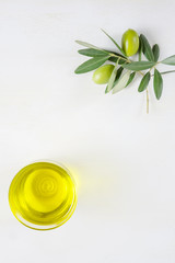 one bowl of extra virgin olive oil on the white table, made in Italy, copy space, top view