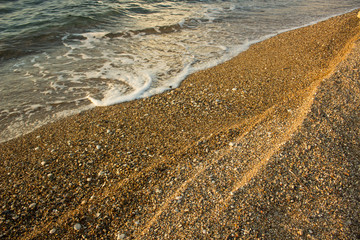 tropic sea sand beach shoreline with fuzzy waves on ground surface