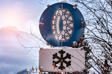 Road sign with the duty of chains on wheels in a mountain village  