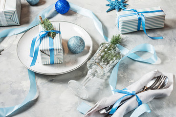 Beautiful Christmas table setting with decorations. Preparation for christmas.