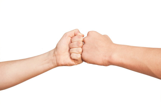 Two different hands folded into fists fighting with each other, measured by force, competing on a white background