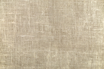 Natural rough beige burlap texture background, top view