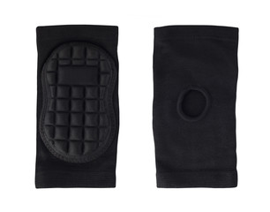 Front and back view of black honeycomb knee or elbow protector pads isolated on white background....