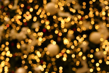 golden bokeh lights on the christmas tree