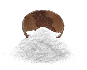 Pile of shredded coconut meat in coconut shell isolated on white background