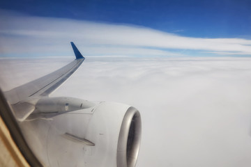 Fototapeta na wymiar View of beautiful cloud and wing of airplane