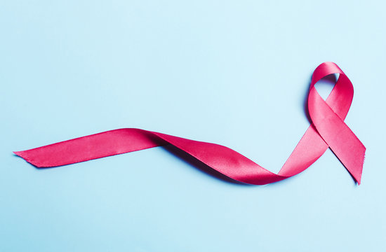 Pink, red ribbon on a blue background.