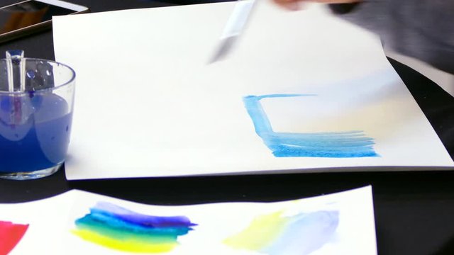 artist's hand draws a gradient