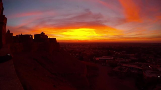 Fanciful pattern of predown bright sky over bastion of desert city Jaisalmer