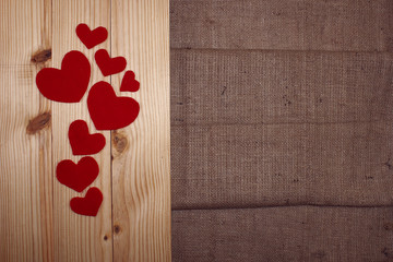 Valentine day, hearth on wood and burlap