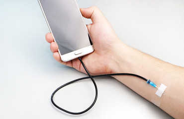 A technology addict. The concept of dependence on the smartphone, phone
