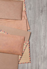 Fototapeta premium Stack of envelopes on wooden