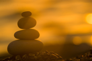 Obraz na płótnie Canvas stack of zen stones on pebble beach