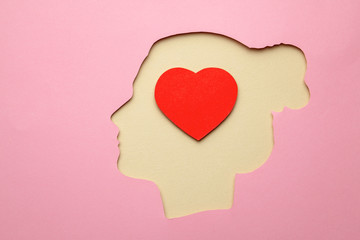 Silhouette of woman and inside the brain in the head heart as symbol of love