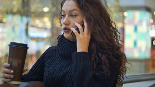 brunette gitl talking on the phone