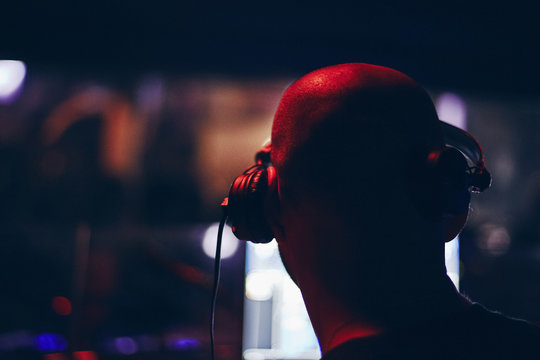 DJ playing box with mixing music on turntables and vinyl records