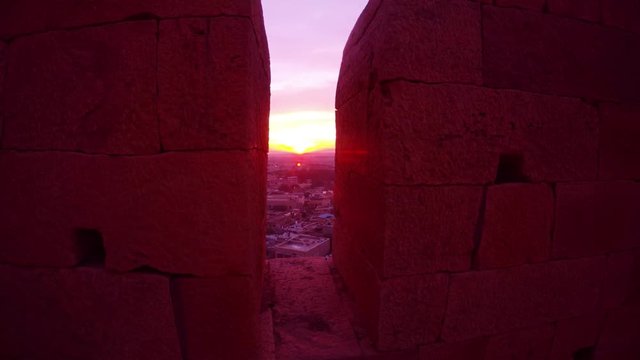 View through marlons on pink sunrise and small town Jaisalmer