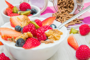 breakfast with yogurt,strawberry rasperry and cereals