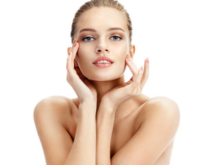 Portrait of beautiful woman touching her face isolated on white background. Youth and skin care...