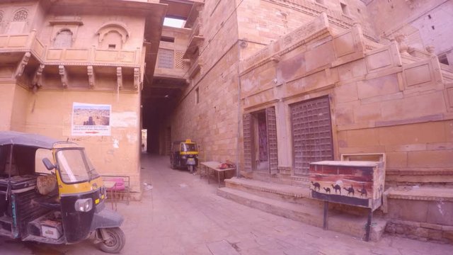 Golden Fort insid haveli auto-rickshaws on parking picture with cemels early morning Jaisalmer