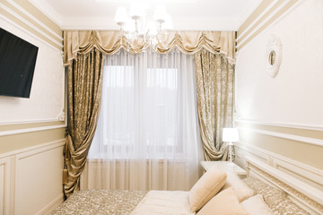 Luxury hotel room with double bed and bright interior