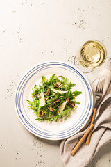 Salad with black truffles, arugula (rucola) and parmesan