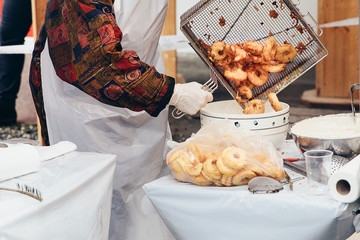 Fresh apple fritters being transferred into a bowl to be sprinkled with cinnamon sugar. Favourite...