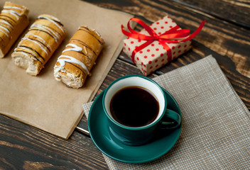 mug of coffee and cake, gift, wooden background