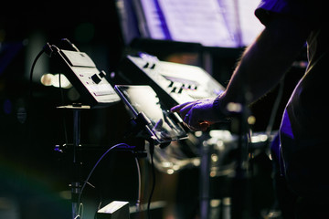 hands tuning a drummer kit © maxwellmonty