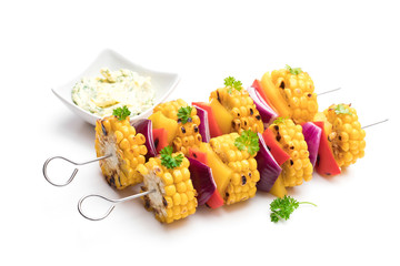 Delicious skewers with grilled corn and pepper isolated on white