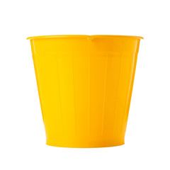 yellow plastic flower pot on white background