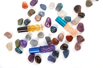 Fashion bottles for parfumes with gems top view isolated on white background with place for text