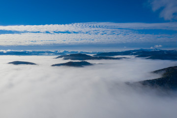 Low clouds in valley, aerial morning scene